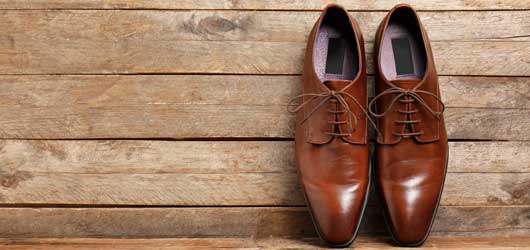 Dress Shoes lined up on fancy boards