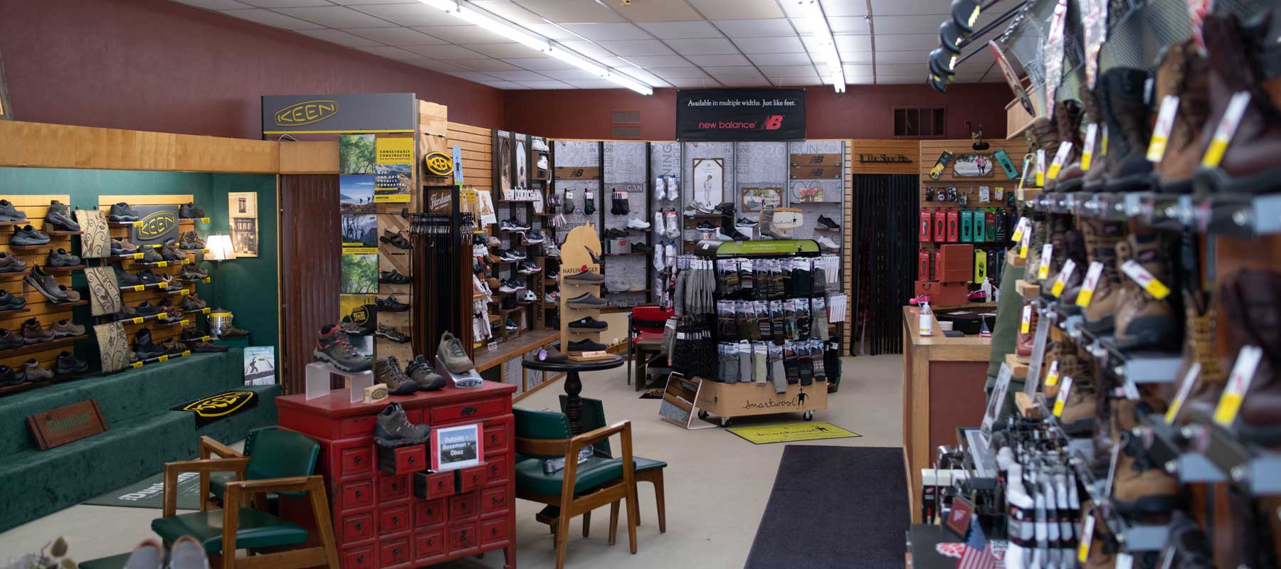 A shoe store interior with plenty of shoes and socks to purchase